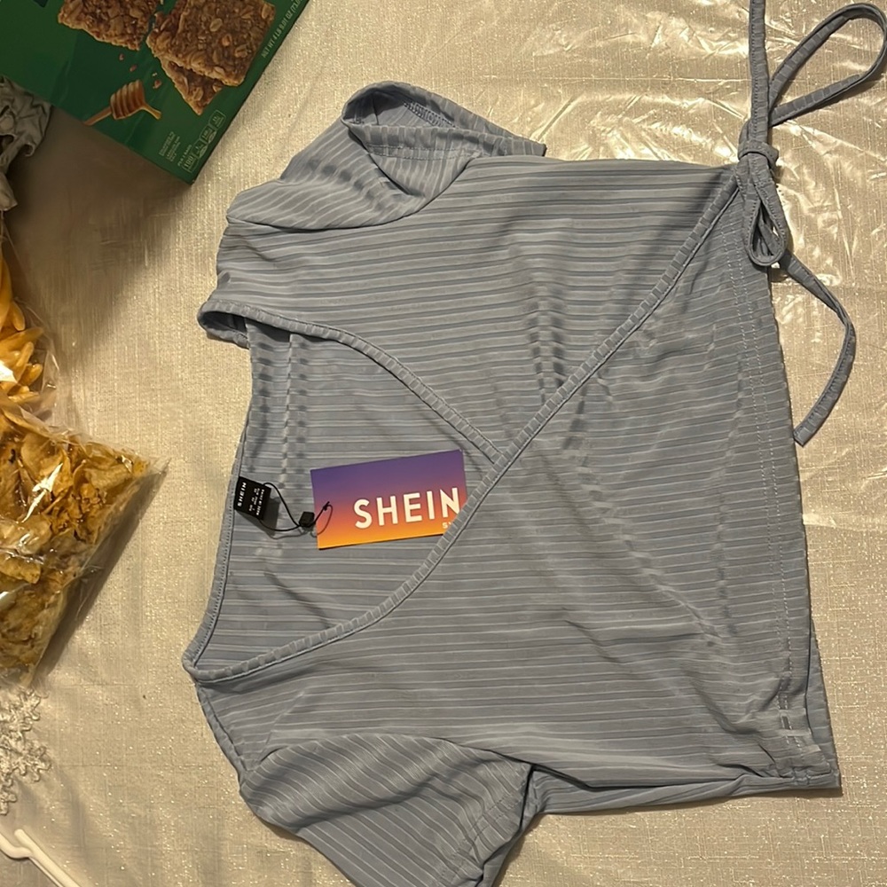 I am selling a shirt, Color is dusty blue, brand is SHEIN, Size is large.